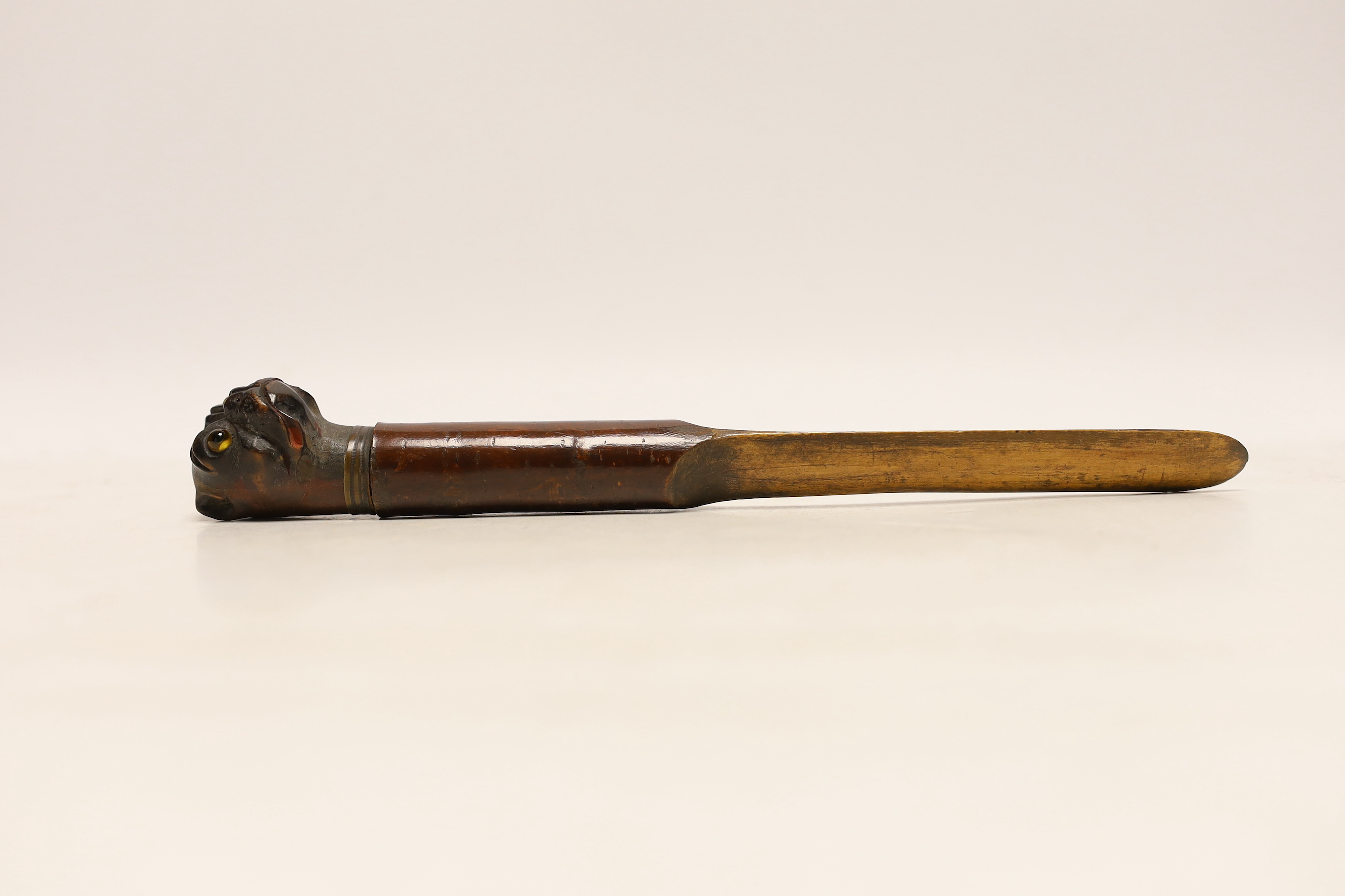 A treen Bulldog head letter opener, c.1900, with glass eyes and metal collar, 27.5cm long